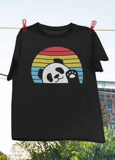 "Product: Retro Panda Cute Panda Bear Vintage Classic T-Shirt, Panda Shirt, Panda Lover Shirt, Cute Panda Shirt, Bear Shirt, Animal Lover Shirt 💫 Welcome to our store! ✔️ PRODUCTS DETAIL: ▸ Available ALL types of clothing you NEED (8 types from kid to adult, hoodies, sweatshirts, tanktop,..) ▸ Light & Soft cotton fabric (Some colours contain polyester). ▸ High-quality Direct To Garment printing, guaranteed not to wash off or fade. ▸ Fit T-shirts, perfect gift idea for your family, friends... ✔️ Cute Pre-shrunk Black T-shirt, Playful Black Crew Neck T-shirt, Cute Black Pre-shrunk T-shirt, Playful Black T-shirt With Funny Print, Playful Black T-shirt With Screen Print, Panda Cute, Panda Shirt, T Shirt Painting, Bear Shirt