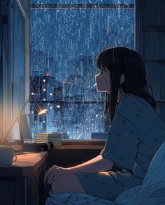 a woman sitting in front of a window looking out at the city lights and rain