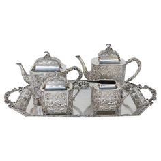 three piece silver tea set with matching tray