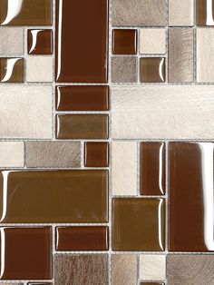 a brown and white mosaic tile pattern with different shades of brown on the tiles, as well as silver foil