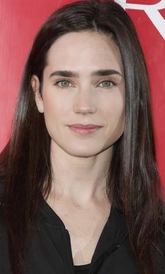 a woman with long hair and black shirt