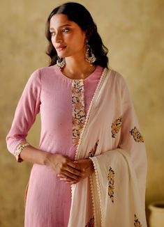 Featuring a pink mukaish kurta with printed placket and sleeve border, this set is complete with a floral block printed palazzo and a cotton dupatta with lace and fringe detailing. Additionally, the kurta has pockets. Composition : Kurta: Mukaish Mul Cotton Lined With Mul Cotton, Palazzo: Cambric Cotton, Dupatta: Mul Cotton Care: Dry Clean Only and Vacuum Storage All products can be customised for sleeves, length of blouse and neck design Delivery : 4-6 weeks as the product is hand crafted. Check Size Guide or choose MySize for free customisation (All Sizes above XL can be made at 15% additional cost) For more information and sizes please contact fabiliciousfashion@gmail.com or visit our Copenhagen studio. Pink Anarkali Cotton Silk Kurta, Pink Palazzo Set With Gota Work And Straight Kurta, Pink Semi-stitched Cotton Silk Kurta, Pink Chanderi Long Sleeve Kurta, Pink Sharara With Straight Kurta For Transitional Seasons, Bollywood Style Pink Cotton Silk Kurta, Pink Cotton Silk Palazzo Set For Eid, Pink Long Sleeve Chanderi Kurta, Pink Cotton Silk Kurta For Navratri