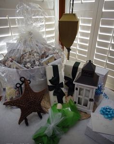 a basket filled with lots of different items next to a candle and some other decorations