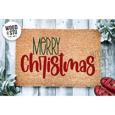 merry christmas door mat with red shoes and plants