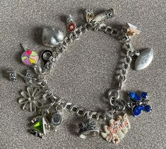 Cute Girly Sterling Silver Charm Bracelet with 15 Charms.  Some charms are enameled. Some have stones.  I believe all are Sterling Silver as well as the bracelet itself.  The telephone handset lifts off the base.  Very cute and unique.  Please email me for International shipping Costs         It comes from a non-smoking home   I ship on Tuesdays and Thursdays Thank you for looking! Silver Enamel Jewelry With Dangling Charms, Silver Enamel Jewelry With Vintage Charm, Silver Costume Jewelry Charm Bracelet, Silver Enamel Charm Bracelets, Silver Enamel Charm Bracelet, Silver Charm Bracelets With Enamel, Silver Enamel Bracelets With Charms, Silver Enamel Bracelet, Silver Charm Bracelet In Costume Jewelry Style