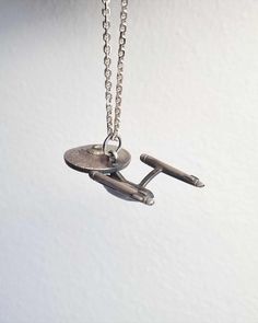 This is my fan art version of the Starship Enterprise from the one and only beloved Star Trek. <3 This spaceship is made my hand from scratch in recycled 925 sterling silver. It's matte finish and had an oxidation surface to make the look just right. :) This pendant necklace is solid silver and a respectable size as well, therefor has a nice weight to it. The measurements are 43 mm lenght, 20 mm width. I hope you love it! :) Adjustable Themed Sterling Silver Necklace, Themed Sterling Silver Necklace, Themed Sterling Silver Necklace In Silver, Space-themed Sterling Silver Jewelry Gift, Silver Space-themed Jewelry Gift, Themed Sterling Silver Nickel Free Necklaces, Themed Sterling Silver Jewelry In Silver, Themed Sterling Silver Nickel-free Necklace, Space-themed Silver Round Pendant Necklace