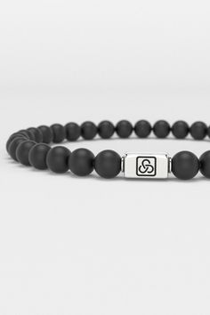 Discover the Essential Bracelet from Seekers, where minimalism meets the ethos of self-expression and refinement. This 6mm bracelet embodies the Seekers' philosophy of understated elegance, catering to the discerning individual who values both simplicity and depth in design. Its sleek onyx beads make a subtle yet impactful statement, perfect for the modern seeker who navigates life with quiet confidence and a keen sense of style. This piece isn’t just an accessory; it’s a testament to the beauty Minimalist Silver Wristband For Everyday, Everyday Silver Minimalist Wristband, Minimalist Jewelry With 8mm Beads, Minimalist 8mm Bead Bracelet Jewelry, Minimalist 8mm Bead Bracelet, Minimalist Black Bracelet, Elegant Adjustable Wristband For Everyday, Minimalist Sterling Silver Bracelet With Beads, Sterling Silver Round Beads Minimalist Bracelet