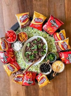 a platter filled with taco salad and chips