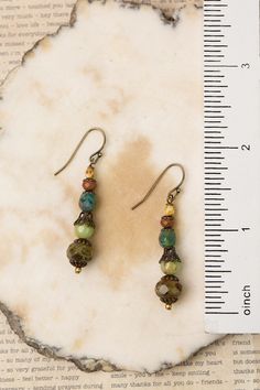 These handcrafted earrings are simple in design featuring stacked Czech glass, perfect for pairing with other items from the Rustic Creek Collection. They are completed with antique brass ear wires and hang at approximately 1.75" in length. Antique Brass (lead and nickel free) Czech Glass 1.75", with antique brass ear wires We hand select our natural materials, thus there may be slight variations in color and/or size that will not detract from the overall aesthetic Our unique handcrafted designe Vintage Everyday Earrings With Ear Wire, Bohemian Glass Beaded Earrings With Ear Wire, Bohemian Beaded Earrings With Glass Ear Wire, Bohemian Jewelry With Adjustable French Hook, Bronze Czech Glass Jewelry With Ear Wire, Nickel-free Glass Bohemian Earrings, Artisan Adjustable Czech Glass Earrings, Artisan Czech Glass Earrings, Adjustable Czech Glass Earrings With Ear Wire