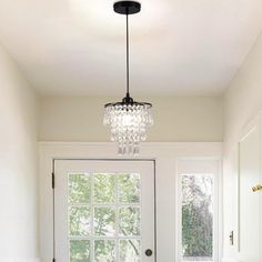 a bathroom with a chandelier hanging from the ceiling