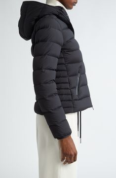 Emblematic of Moncler's Matte Black collection, this channel-quilted puffer jacket is packed with premium down and equipped with plenty of zip pockets. Two-way front-zip closure Fixed hood Vertical chest-zip pocket; front zip pockets Drawcord-toggle hem Lined, with down fill 85% polyamide, 15% elastane Dry clean Imported Designer Clothing Black Duck Down Puffer Jacket With Double-lined Hood, Black Quilted Duck Down Puffer Jacket, Luxury Black Puffer Jacket With Detachable Hood, Black Luxury Quilted Puffer Jacket, Luxury Black Puffer Jacket With Zipper Closure, Black Duck Down Outerwear With Zipper Closure, Luxury Black Quilted Puffer Jacket, Black Down Puffer Jacket With Double-lined Hood, Black Down Puffer Jacket With Zipper