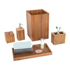 bathroom accessories including soap, toothbrushes, and other items on a wooden tray