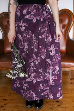 This beautiful purple colored maxi skirt is a unique vintage piece. I'ts a hand-sewn skirt that was used in a theatre. The floral patterned skirt is guaranteed to be your new favorite piece for summer and fall. It is wide and airy and very long. Combine it with some boots for a chunky look or with sandals, a short top and some eye-catching accessories and you have a special outfit for any occasion.  THE DETAILS: -beautiful floral vintage skirt -no size as it is custom made, please check the meas Vintage Purple Lined Skirt, Vintage Purple Skirt For Summer, Purple Bohemian Lined Skirt, Bohemian Purple Lined Skirt, Purple Bohemian Maxi Skirt, Purple Flowy Long Dress, Purple Relaxed Lined Maxi Skirt, Relaxed Purple Maxi Skirt With Lining, Purple Relaxed Maxi Skirt With Lining