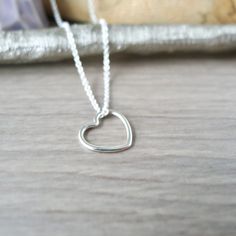 A little heart for a little love.An 11mm Sterling Silver Heart pendant hung on a Sterling Silver Chain Necklace.✭ CUSTOMIZE YOUR PIECE ✭► Choose your chain length 16in or 18in options for No Additional Charge! Don't see the length you need? Check out our Custom Length Upgrade: https://www.etsy.com/ca/listing/198366701/custom-chain-length-upgrade► Upgrade to a Thicker Chain here:https://www.etsy.com/ca/SilverMooseArts/listing/817185940/chain-upgrade-sterling-silver-chain► You can also personalize Handmade Minimalist Heart Necklace For Valentine's Day, Tiny Dainty Heart Necklace, Dainty Tiny Heart Necklace, Minimalist Heart Charm Necklace With Heart Beads, Simple Everyday Heart Charm Necklaces, Minimalist Heart Beads Charm Necklace, Delicate Tiny Heart Necklace, Simple Heart Charm Necklaces, Simple Heart Charm Necklaces For Mother's Day