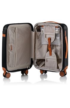 This retro-inspired carry-on suitcase is the ideal travel companion thanks to an expandable packing space, secure water-resistant shell, USB charging port and 360-degree spinner wheels. 21" x 13.5" x 9 Telescopic top handle, top and side flat handles Zip around closure TSA approved locking mechanism Polycarbonate Lined Imported Black Rectangular Luggage With Sleeve, Modern Black Luggage With Luggage Sleeve, Modern Black Luggage With Sleeve, Functional Case With Luggage Sleeve For Overnight Trips, Functional Travel Cases With Luggage Sleeve, Black Cases With Luggage Sleeve For Trip, Black Rectangular Travel Cases, Black Rectangular Luggage For Trips, Black Luggage With Sleeve For Trip