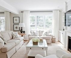 a living room filled with furniture and a fire place