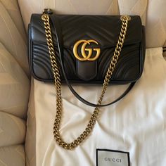 Gucci Handbags Medium Size In Black In Perfect Condition Got It From Neiman Marcus Classic Black Gucci Shoulder Bag, Designer Gucci Shoulder Bag With Chain Strap, Gucci Black Bag With Gold-tone Hardware, Classic Gucci Bag With Chain Strap, Black Gucci Bags With Branded Hardware, Black Designer Gucci Bag, High-end Black Gucci Shoulder Bag, Elegant Black Gucci Bag, Black Gucci Shoulder Bag With Branded Hardware