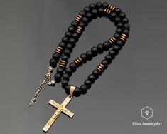 "Limited Edition Zirconia Cross Necklace Stailess Steel Pendant Black Lava Hematite Beaded Calming Necklace For Him Unisex Christmas Gift -ALL THE PRODUCTS AT ELISAJEWELRYART ARE HANDMADE AND MADE WITH NATURAL BEADS. -WHAT DOES THE LAVA STAND FOR     Lava Stone is a grounding stone that strengthens one's connection to Mother Earth. It gives us strength and courage, allowing us stability through times of change. It provides guidance and understanding in situations where we may need to \"bounce ba Beaded Cross Pendant Jewelry Gift, Beaded Cross Pendant Jewelry For Gift, Unisex Christmas Gifts, Cardboard Jewelry Boxes, Hematite Beads, Lava Bead, Pendant Bracelet, Adjustable Necklace, Natural Beads