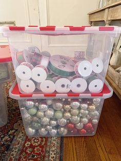 a plastic container filled with lots of christmas ornaments