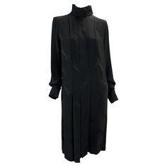 Presenting a gorgeous black silk pleated Yves Saint Laurent Rive Gauche monogram dress. From the Fall/Winter 2000 collection by Albert Elbaz, this long-sleeve dress features a hidden button-up front, mock neck, flowing sleeves, and pleating at the body. This incredible dress is covered in the brand's 'YSL' monogram. A rare find, this vintage monogram-mania dress remains effortlessly chic and timeless. Approximate measurements: Size - FR38 Bust: 38" Waist: 34" Hips: 49" Shoulder to hem: 42" Shoul Ossie Clark, Alber Elbaz, Slim Aarons, Vintage Monogram, Rive Gauche, Monogram Prints, John Galliano, Black Silk, Pleated Dress