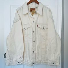 White/Off White Denim Levi’s Women’s Baggy Trucker Jacket. Relaxed Fit. Buttons Down Center, On Cuffs Of Sleeves, And At Bottom Hem On The Back. 2 Flap/Button Closure Pockets On Chest, 2 Seam Style Pockets On Waist. Size 3x. Made Of 100% Cotton. New With Tags. Feel Free To Ask Questions Or Make Me An Offer!! Classic White Denim Jacket For Fall, Oversized White Classic Outerwear, White Oversized Classic Outerwear, Classic White Denim Jacket With Pockets, Classic White Denim Jacket For Workwear, Classic White Oversized Outerwear, White Relaxed Fit Button-up Outerwear, White Relaxed Fit Outerwear With Button Closure, White Relaxed Fit Classic Denim Jacket