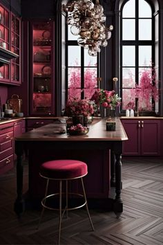 a kitchen with purple cabinets and pink stools