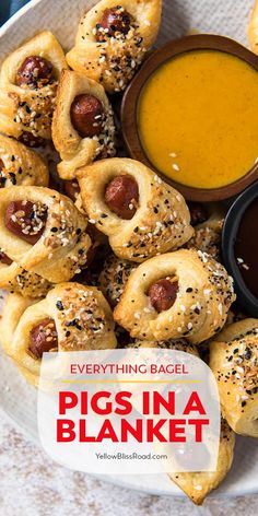 pigs in a blanket on a plate with dipping sauce next to it and the title overlay reads everything bagel pigs in a blanket