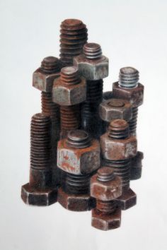 a pile of nuts and bolts sitting on top of each other in front of a white background