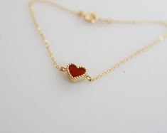 Tiny and dainty red agate heart filled with love and passion, such a perfect present for Valentine's Day and your loved ones. :: Style name: RDHRT-ENLB1004 :: Heart size: 7x7.5mm :: Material: 14k solid yellow gold :: Stone type: red agate Notes :: Jewelries are measured in millimeters and centimeters. :: Please read store policy before placing order. :: In stock items are ready to ship in 3 business days, made to order items are ready to ship in 2-4 weeks. :: International Shipping AVAILABLE. :: Red Heart Bracelet For Valentine's Day Anniversary, Minimalist Heart Bracelet For Valentine's Day Gift, Personalized Red Heart Bracelet, Valentine's Day Gift: Open Heart Bracelet, Minimalist Red Heart-shaped Jewelry, Red Heart-shaped Bracelets As A Gift, Red Heart-shaped Bracelets For Gift, Red Heart Charm Fine Jewelry, Heart Charm Bracelet For Valentine's Day Gift