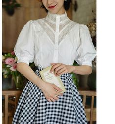 White lace blouse with eye-catching embroidery on the chest.
 It gives the impression of a neat and elegant young lady.
 The balance between the puff sleeves and the cinched waist is beautiful, creating a classic style.



 <Size>





 small size



 Length: 56cm

 Shoulder width: 35cm

 Bust: 88cm

 Sleeve length: 32cm




 medium size



 Length: 57cm

 Shoulder width: 36cm

 Bust: 92cm

 Sleeve length: 33cm




 L size



 Length: 58cm

 Shoulder width: 37cm

 Bust: 96cm

 Sleeve length: 33.5cm











 <Material>



 cotton






 <model wearing>



 wearing size



 medium size




 model dimensions



 Height: 170cm

 Weight: 55kg

 Bust: 84cm

 Waist: 65cm

 Hip: 94cm Classic Tops With Lace Collar And Puff Sleeves, Classic Top With Lace Collar And Puff Sleeves, Formal Lace Patchwork Blouse, Puff Sleeve Blouse With Lace Cuffs For Daywear, Vintage Blouse With Lace Sleeves, Feminine Formal Blouse With Lace Patchwork, Feminine Lace Patchwork Blouse For Formal Occasions, Elegant Puff Sleeve Lace Top, Elegant Lace Top With Puff Sleeves