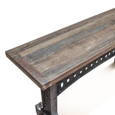 an old wooden table with metal legs on a white background and no people around it