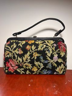 "Circa 1970s kadin neddlepoint handbag with single handle. Interior pocket. Has wear consistent with age. Lining in good condition.  13\" wide 13\" tall with handle" Vintage Evening Bag In Tapestry Material, Vintage Satchel Clutch With Detachable Strap, Vintage Tapestry Bag For Evening, Vintage Satchel With Detachable Strap And Double Handle, Mid-century Rectangular Satchel For Everyday Use, Formal Tapestry Bags, Vintage Satchel With Handle Drop, Vintage Tapestry Shoulder Bag For Evening, Vintage Tapestry Bag For Formal Occasions