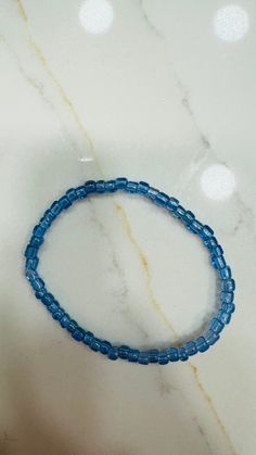 Blue clear bracelet. It's a nice bracelet to wear in a set of blue ones. It's durable, strong, stretchy, it should fit all. Trendy Blue Stretch Bracelet For Everyday Wear, Trendy Blue Stretch Bracelet For Everyday, Blue Beaded Bangle Bracelets For Everyday, Trendy Blue Stretch Bracelet With Round Beads, Casual Blue Stretch Bracelet For Everyday, Casual Blue Hypoallergenic Jewelry, Everyday Blue Beaded Bangle Bracelets, Everyday Blue Beaded Bangle Bracelet, Everyday Blue Hypoallergenic Bracelets