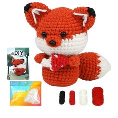 a crocheted stuffed animal is shown with yarn, scissors and other crafting supplies