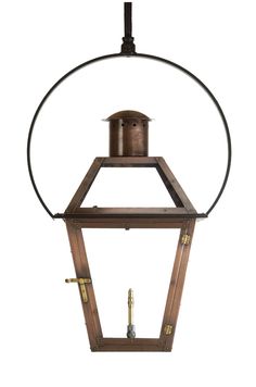 an old fashioned lantern hanging from the ceiling with a circular light fixture on it's side