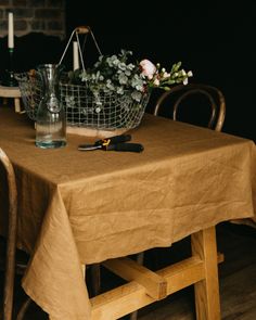 a table with a basket and flowers on it