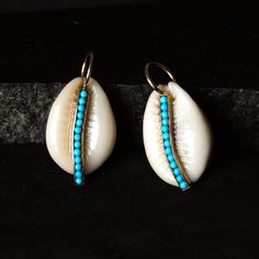 Cowrie shell is very popular these days. It's unique shape is much more inspirable to make it statement piece of adornments.  you can have one or more. but it is must have piece of jewelry. It is made with solid 14k Yellow gold. It can be a perfect gift for yours's or yourself. You can contact me if you have any query about anything.  Have a FINE ADORNMENT!! :) ✦ This is the perfect gift for mom, wife, fiancée, girlfriend, valentine, daughter, family or friend. It is a special gift for mother's day, valentine's day, wedding, anniversary, birthday, Christmas, Easter, New Year's and any holiday. ✦ Custom Orders : Since most products are handmade and made by members of my shop , you can ask us any kind of customization. You can choose from 14k Gold, 925 Silver And Diamond. For most of the ite Bohemian White Jewelry For Holiday, Unique Blue Jewelry For Vacation, Unique Turquoise Jewelry For Vacation, Turquoise Shell Jewelry For Vacation, Turquoise Shell Jewelry For Gifts, Handmade Turquoise Shell Jewelry, Blue Shell Jewelry As A Gift, Blue Shell Jewelry For Gifts, Handmade Blue Shell Jewelry