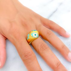 This 21k gold ring features a trendy and distinct evil eye design, symbolizing protection and style. Weighing 5.5 grams, the ring is finished in radiant yellow gold and is available in a size 9, with sizing options available. The eye-catching evil eye motif adds a unique and fashionable element, making this ring perfect for those who appreciate meaningful jewelry with a contemporary twist. Ideal for everyday wear or as a statement piece, this ring seamlessly blends tradition with modern design. Evil Eye Design, Meaningful Jewelry, Eye Design, Evil Eye, Statement Pieces, Everyday Wear, Gold Rings, Yellow Gold, Gold