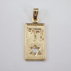 Vintage 14K Yellow Gold Star of David and Chai Charm Pendant. This charm is Solid 14K Yellow gold and weighs 1.7 grams. This pendant measures 19.5 X 10.5 mm without the bail. I will ship this pendant promptly in a gift pouch. Yellow Gold Star Of David Charms Jewelry, Celebration 14k Gold Jewelry, 14k Gold Star Of David Jewelry For Anniversary, Symbolic 14k Gold Star Of David Jewelry, Rectangular Gold Jewelry For Celebration, Celebration Jewelry In Stamped 14k Gold, 14k Gold Star Of David Jewelry, Gold Star Of David Jewelry For Anniversary, Yellow Gold Jewelry With Polished Finish, Star Of David