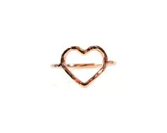 Embrace a subtle token of love with our Petite Heart Pinky Ring, meticulously handcrafted by local artisans. Handcrafted from .925 Sterling Silver, 14kt Yellow Gold Filled, or 14kt Rose Gold Filled, this delicate ring carries a simple yet profound message. Each petite heart, measuring approximately 3/8” X 1/2”, is individually shaped and lightly hammered, making every ring a unique creation. Versatile in its design, it can be worn as a pinky ring, midi ring, or toe ring, adding a touch of elegan Delicate Hand Forged Ring As A Gift, Delicate Hand Forged Rings As Gift, Rose Gold Open Heart Ring With Heart Charm, Valentine's Day Delicate Open Heart Ring, Rose Gold Hammered Midi Rings As Gift, Dainty Hand Forged Stackable Rings As A Gift, Heart Shaped Rose Gold Sterling Silver Stackable Rings, Heart-shaped Rose Gold Stackable Rings In Sterling Silver, Delicate Hammered Rings As A Gift