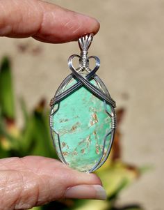 This is a Beautiful Large Natural Chrome Variscite Gemstone Pendant!!  The colors of this stone are yummy   Mint Greens, Tan and a touch of Cream.  This Rare Chrome Variscite is from Australia and is very hard to find in this High Quality.   Variscite is a fairly rare stone that occurs in varying shades of green.  Also known as Utahlite, it is commonly found in Utah and Nevada as well as Queensland, Australia.  This Pendant is a Large Size, Oval Shape with a High Polish.  The polish is silky smooth and has a wonderful calming feel.   You will not find another Pendant like this one!  Please be sure to check the measurements below, the Pendants may appear smaller or larger in the pictures.  This stone is known for it's remarkable soothing and clarifying properties.  It promotes a serenity th Rare Stone, Sterling Silver Wire Wrap, Wire Wrapping Stones, Recycled Silver, Jewelry Gift Box, Stone Necklace, Silver Wire, Stone Pendants, Gemstone Pendant