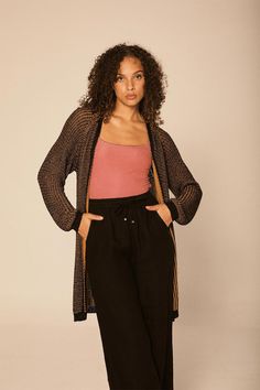 3/4 length cardigan knitted in Italy. The two-color yarn silhouette is designed for a loose fit. Pair it with your favorite bottoms. 80% Viscose 20% Polyester Machine wash Crafted in Italy One Size Cardigan Knitted, Boho Cardigan, Long Knit Cardigan, Cardigan Jacket, Yarn Colors, Black Cardigan, Black And Gold, Three Quarter, Knit Cardigan