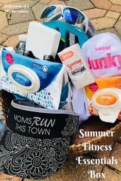 a basket filled with personal care items sitting on top of a stone floor next to sunglasses