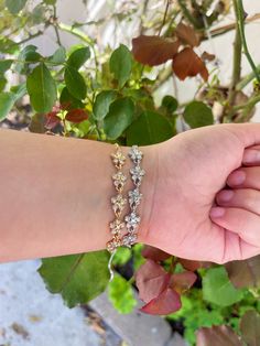 Gold bracelet with flower detailing. Gold Flower Bracelet, Silver Flower Bracelet, Gold Flower, Flower Bracelet, Silver Flowers, Gold Flowers, Silver Bracelet, Gold Bracelet, Bracelet