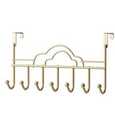 a gold metal rack with hooks on it