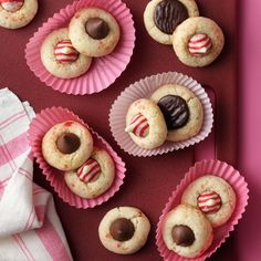 cookies with chocolates and candy on pink tray