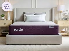 the purple mattress is on display in front of two nightstands and a table with lamps