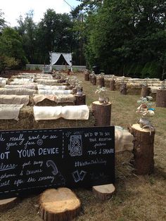 there is a sign that says not your device next to some logs in the grass