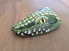 a fake alligator's head is sitting on the floor