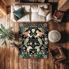 an overhead view of a living room with wood flooring and wall decor, including a large rug